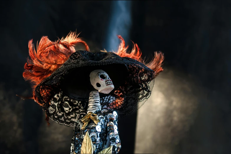 a doll dressed in a costume on stage