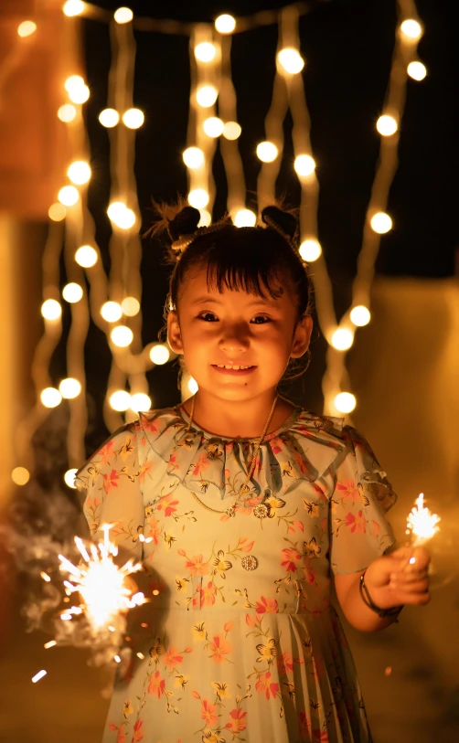 a  holding a sparkler up to the camera