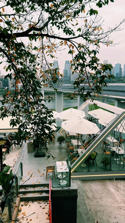 there is some chairs and umbrellas on the street