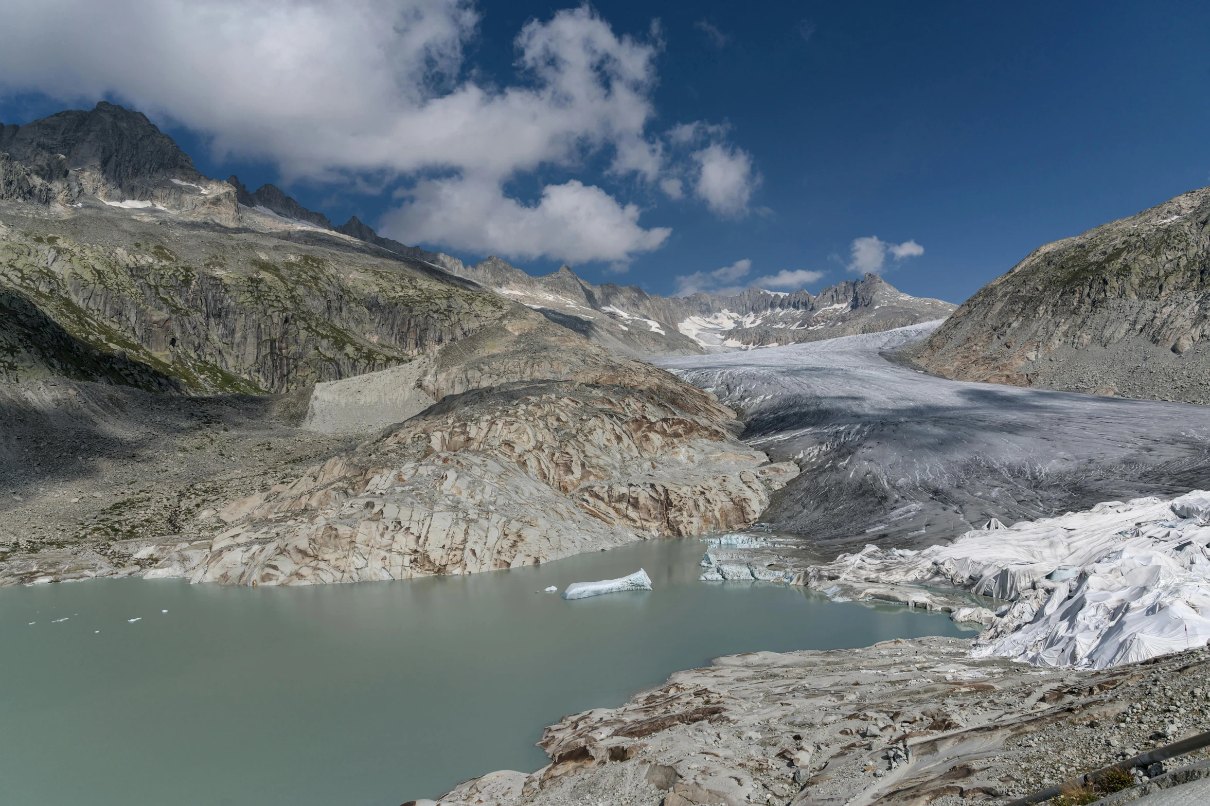 an expanse of mountains with some water in it