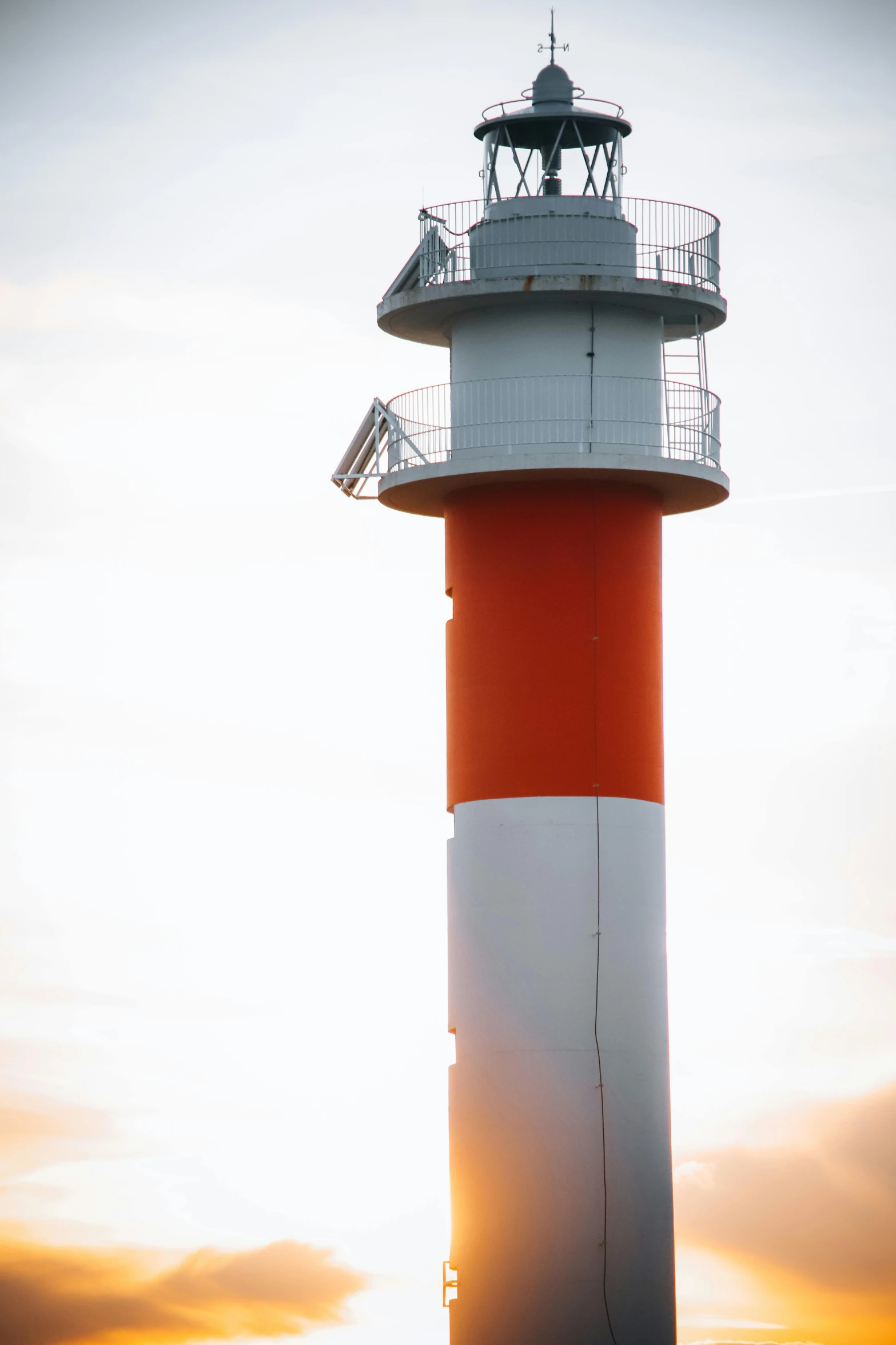 a lighthouse that is standing in the middle of water