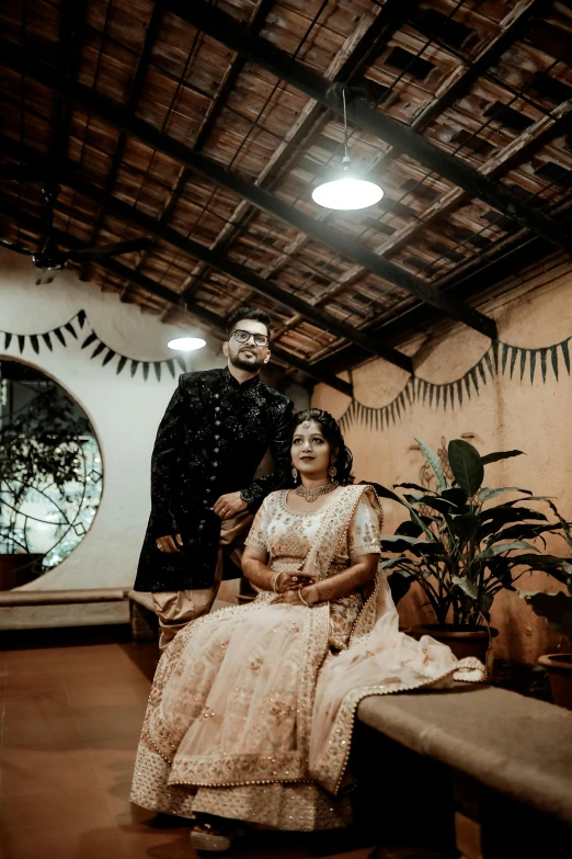 the bride and groom are sitting in their bridal portraits