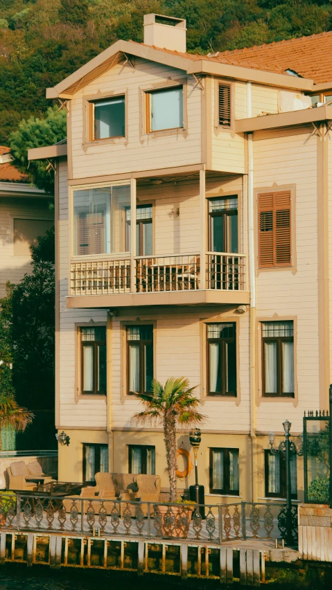 an apartment with balconies overlooks the water