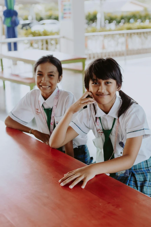 two s sit at a table together