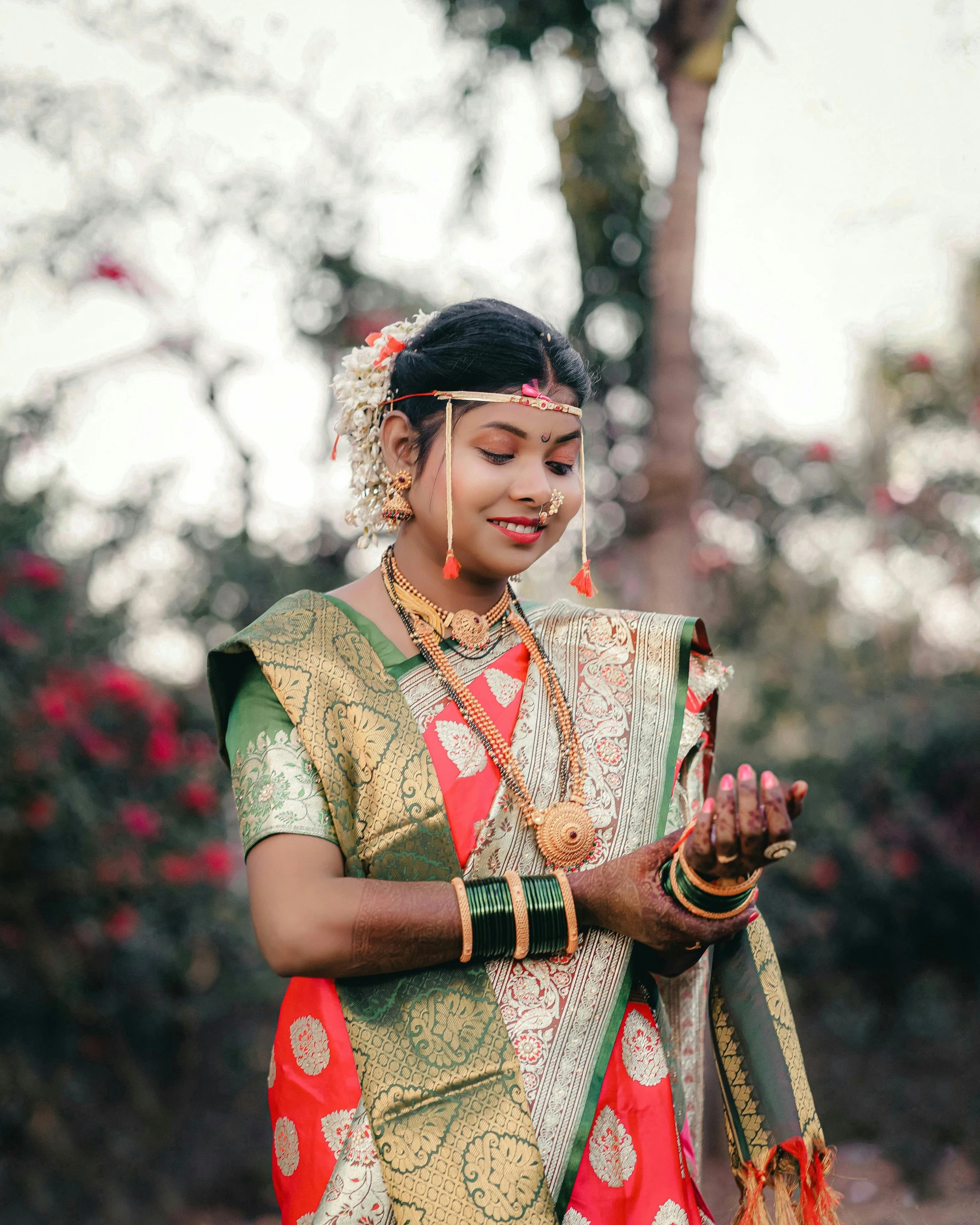 an indian woman holding her phone in her hand