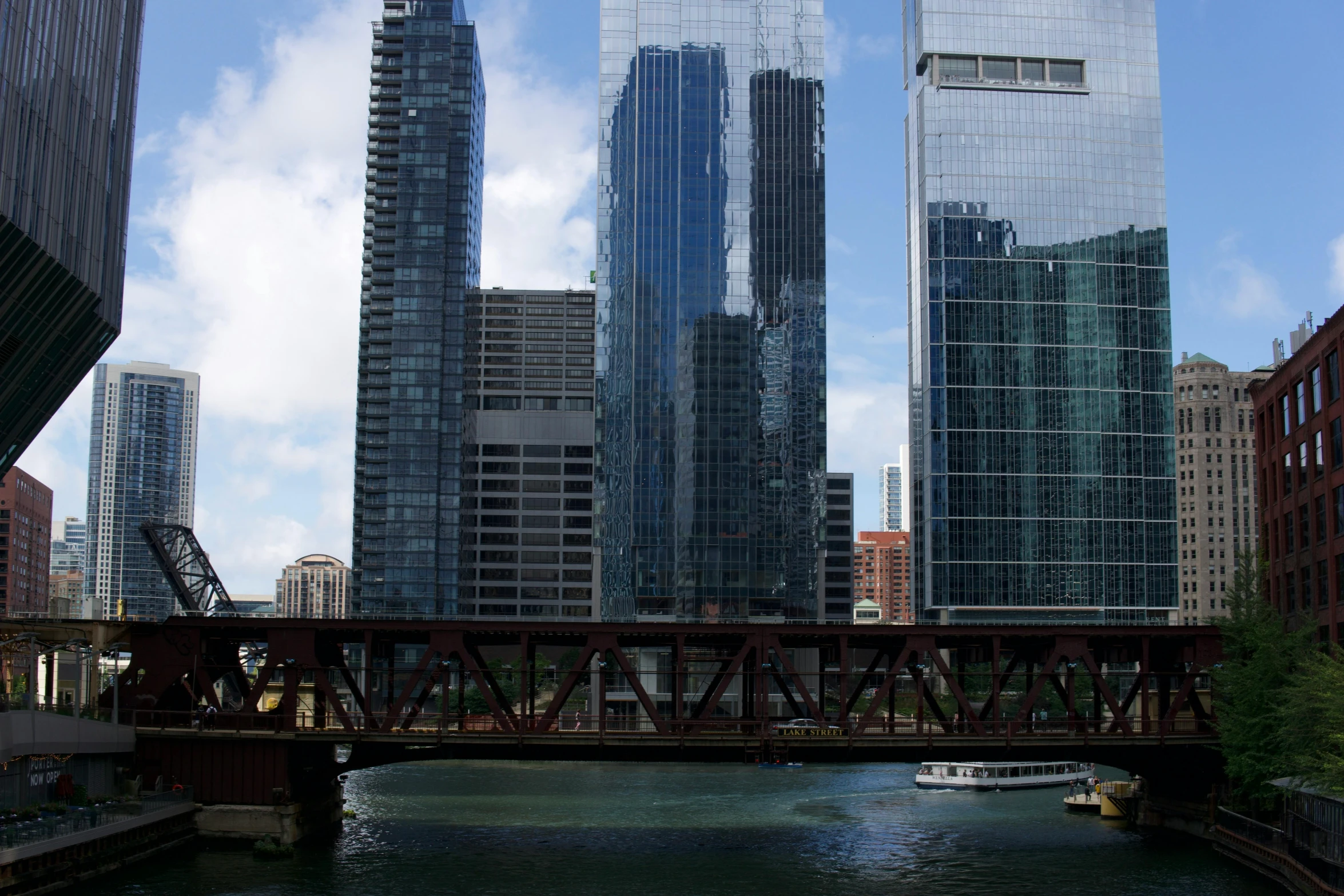 a river with lots of water in it next to tall buildings