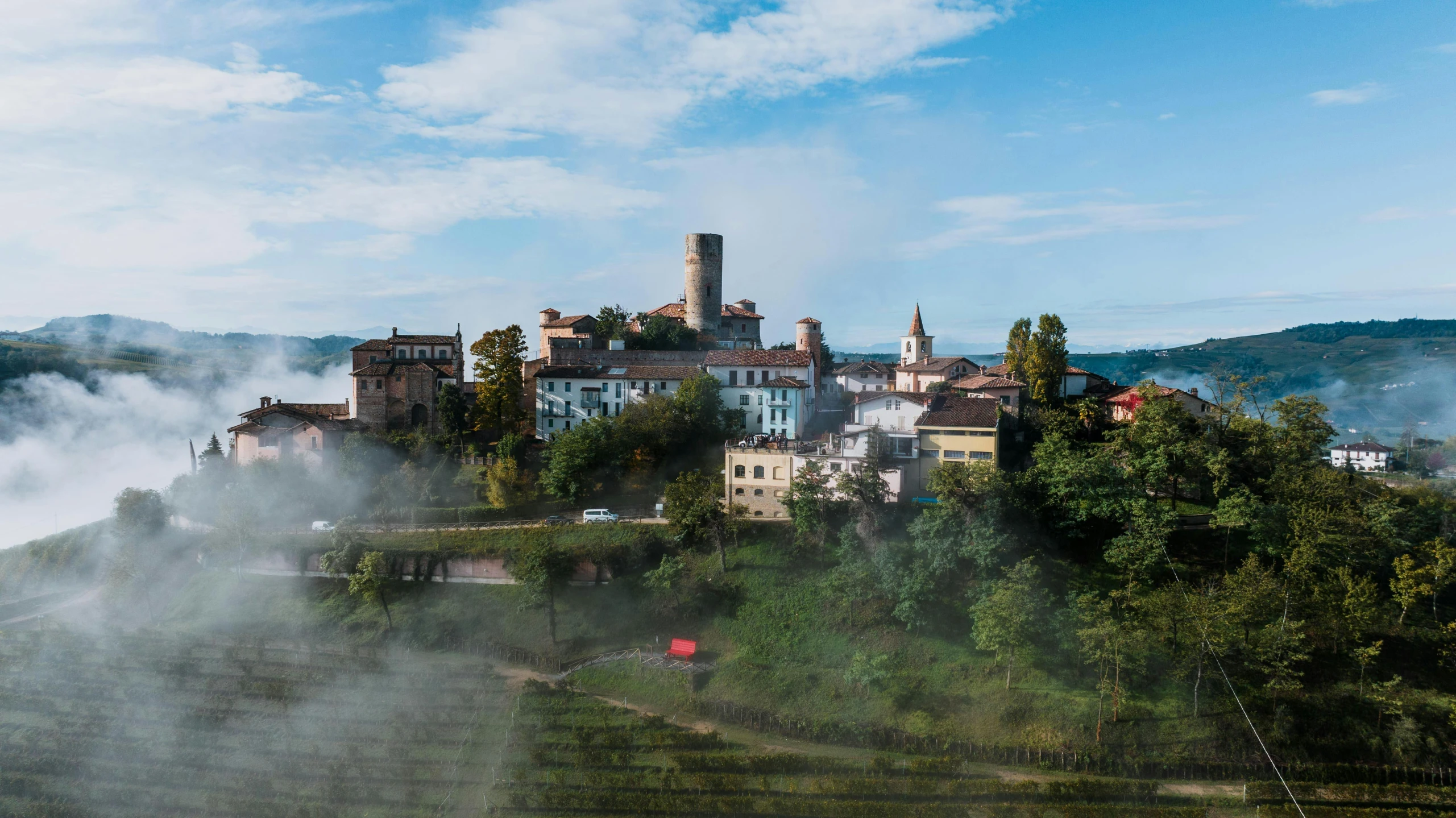 there are buildings that are perched on the hill