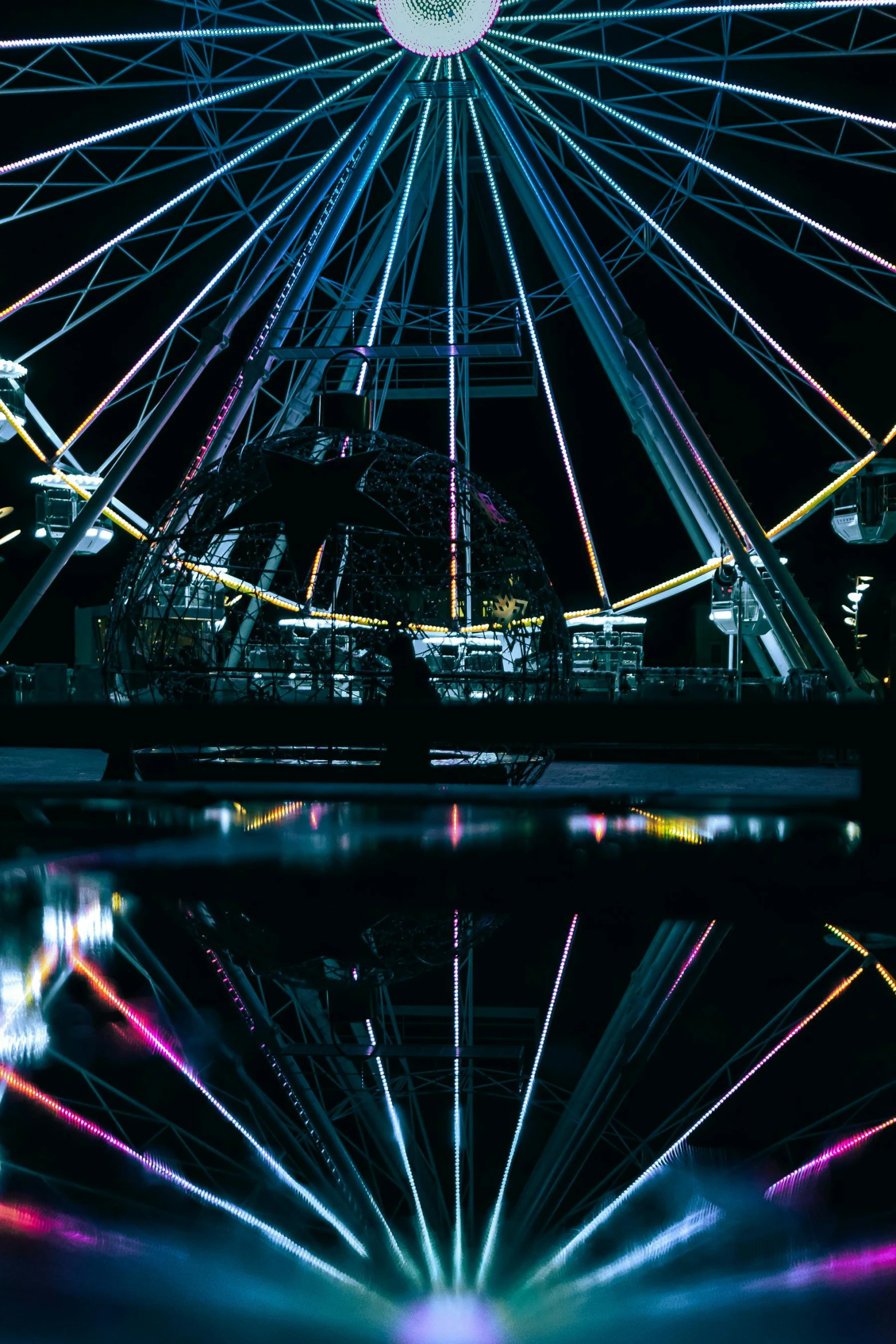 some lights and buildings and water at night