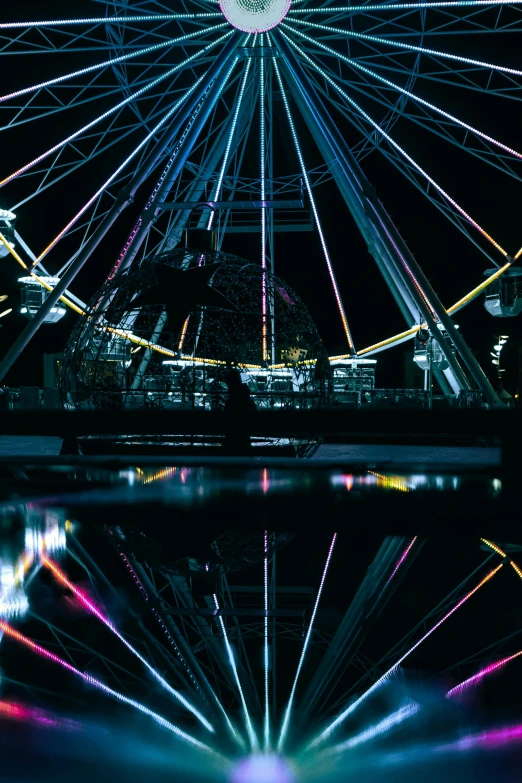 some lights and buildings and water at night