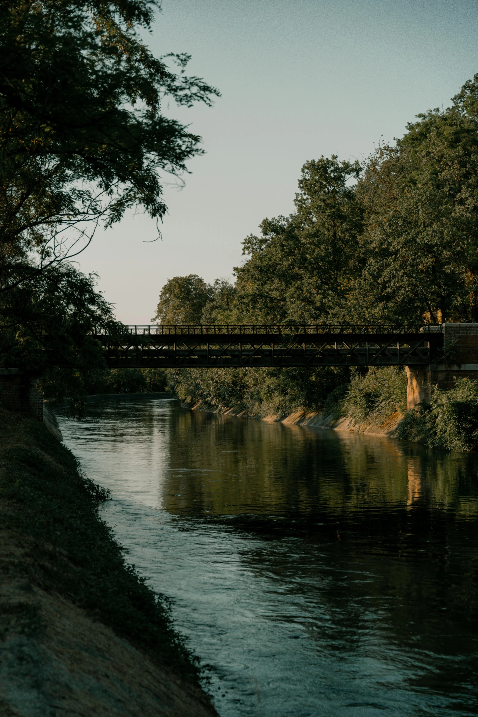 a bridge over a river with people on it