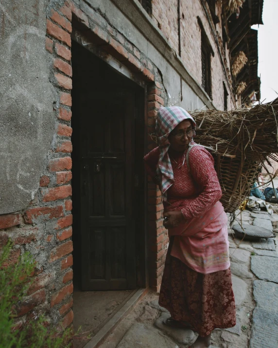 an old woman with a blanket on her head