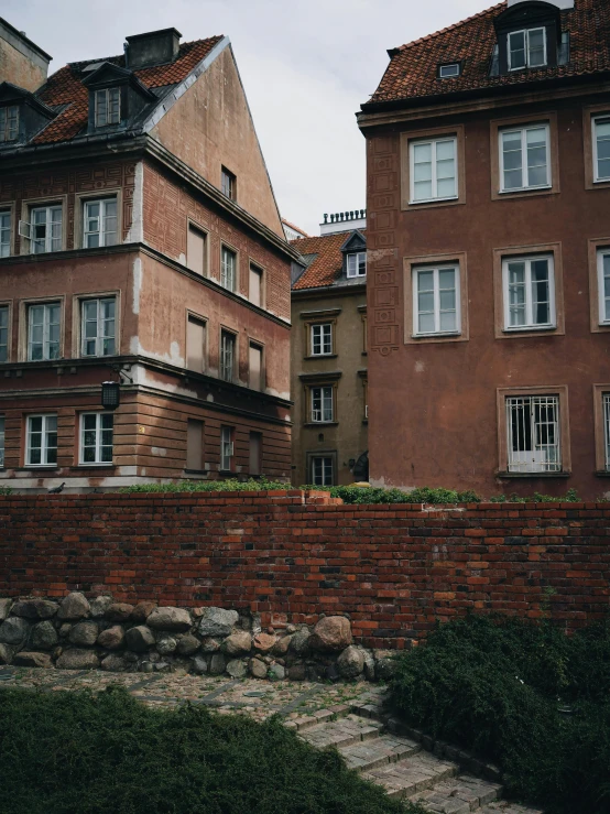 old buildings lined up against a brick wall