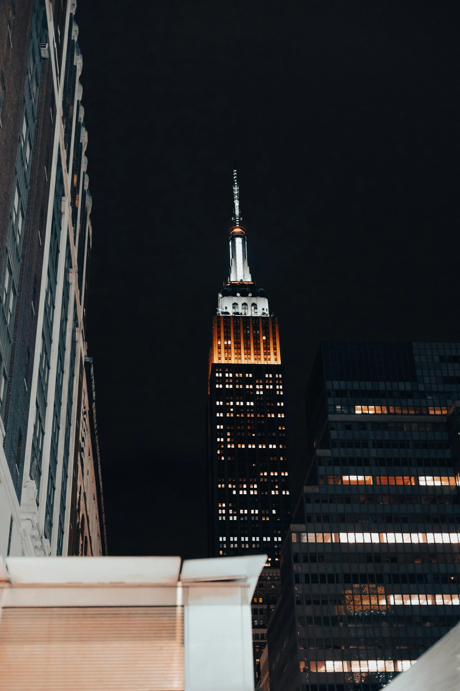 skyscrs in the city at night with a bright sky