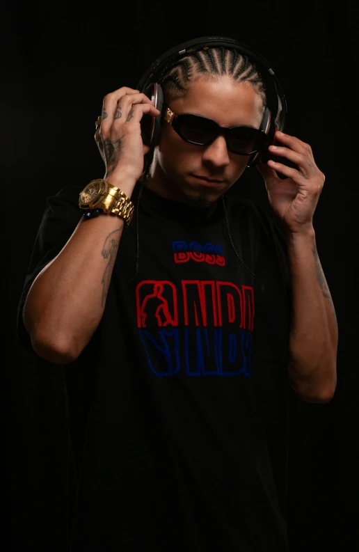 a man with sunglasses on headphones and wearing a shirt