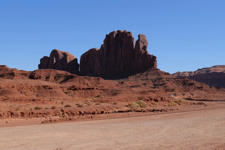 a desert landscape with tall, rock formations