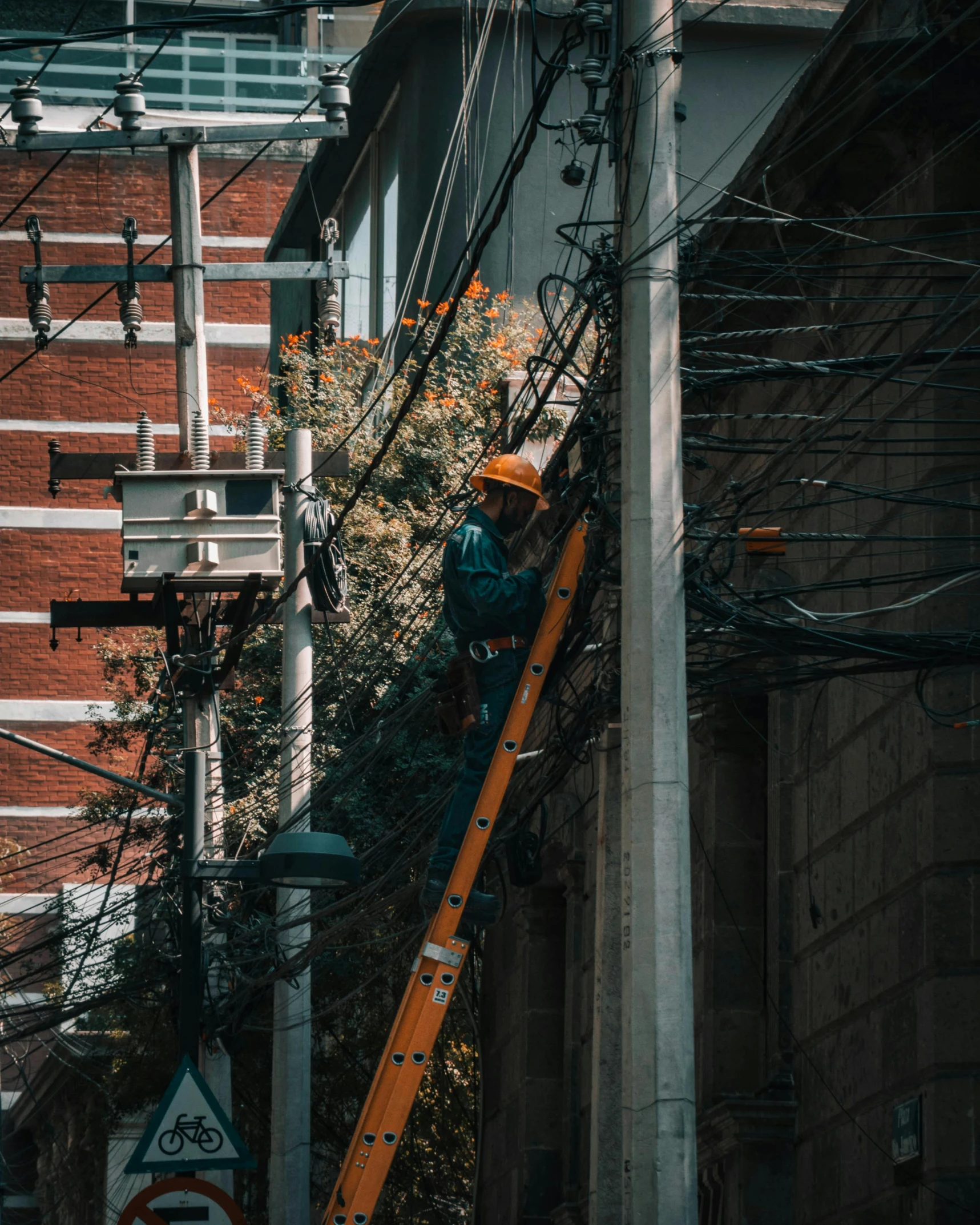 a person standing on top of an electric box