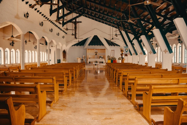 rows of pews in an empty church