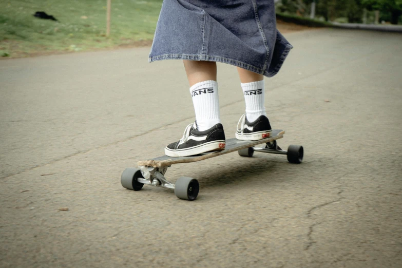 this po shows someone wearing socks and socks, riding a skateboard on the street