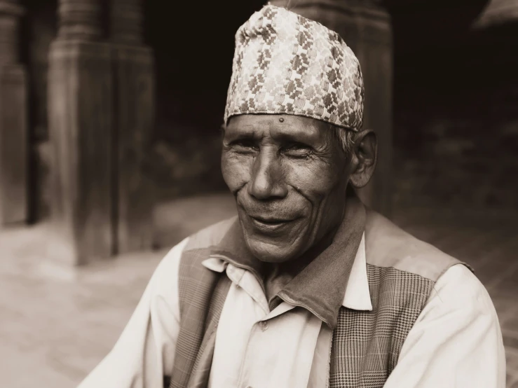 an old man with a big hat on his head