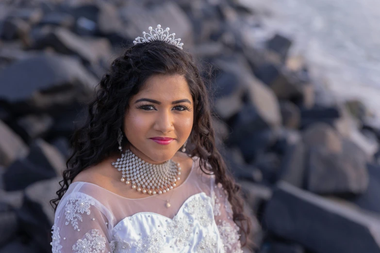 a woman posing for a po with a diamond tiara