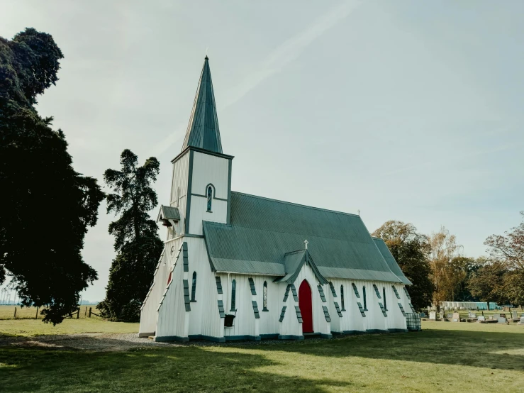 an old church with a steeple and clock tower