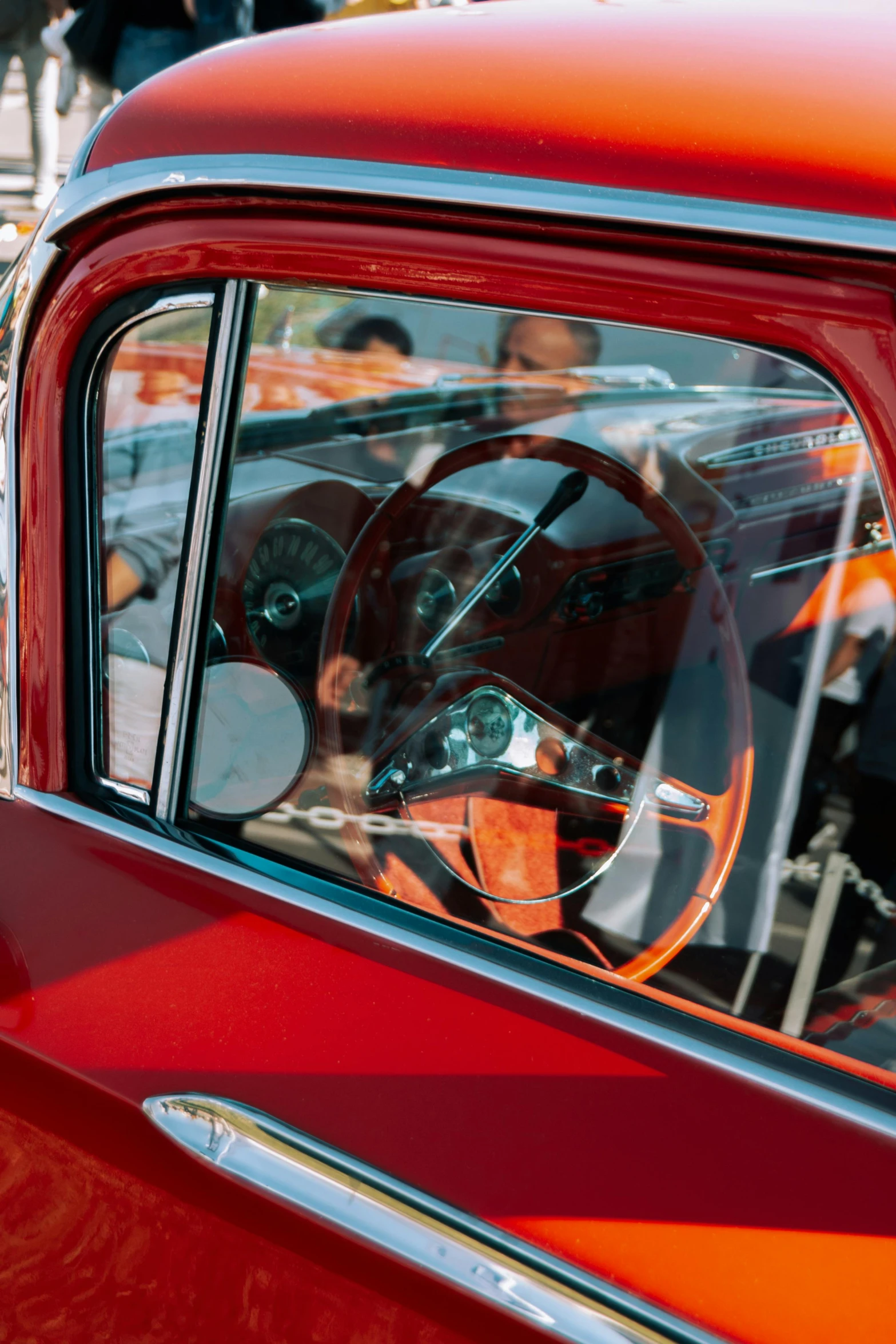 a classic red truck with a window full of glass