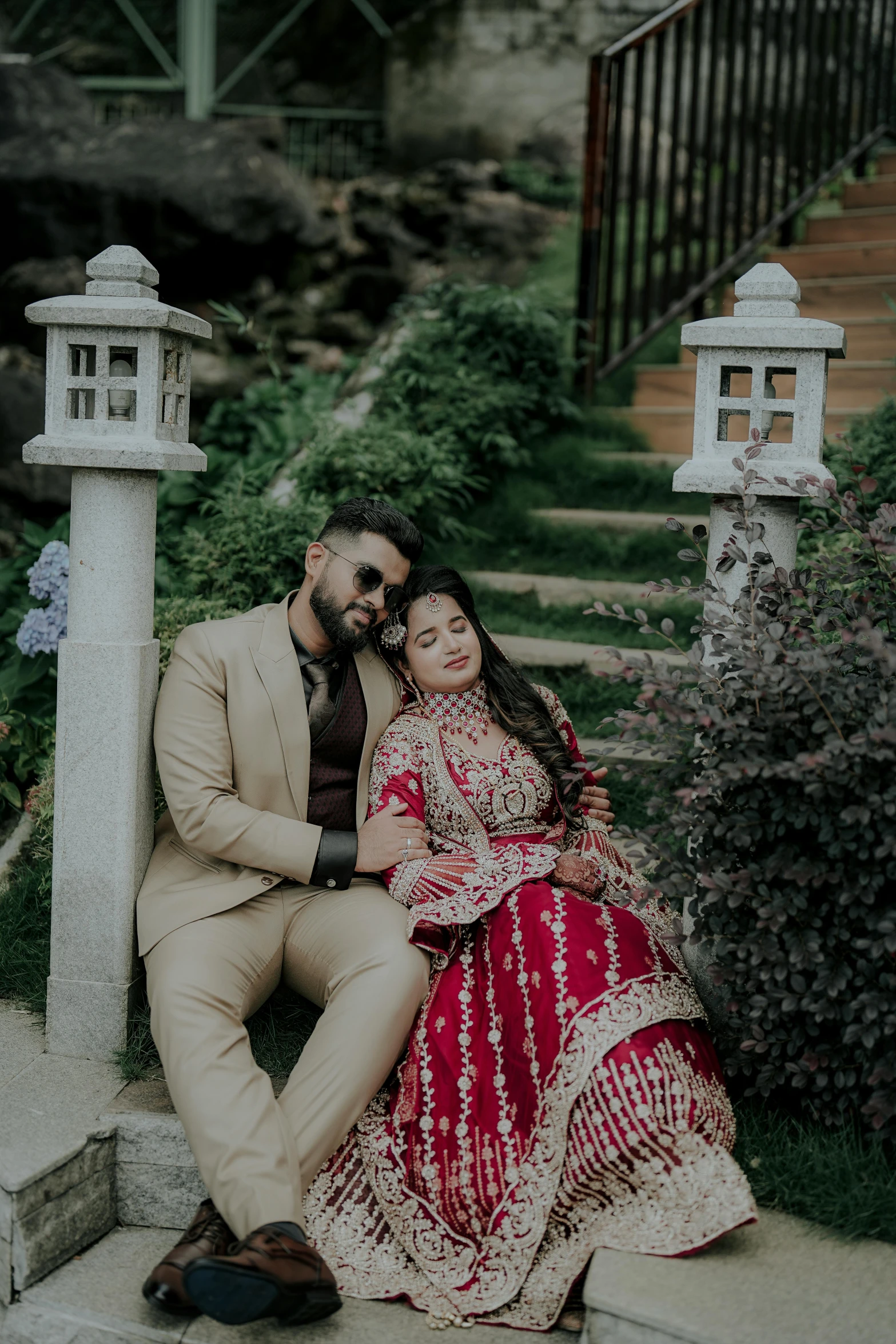 a couple sitting together while posing for a picture