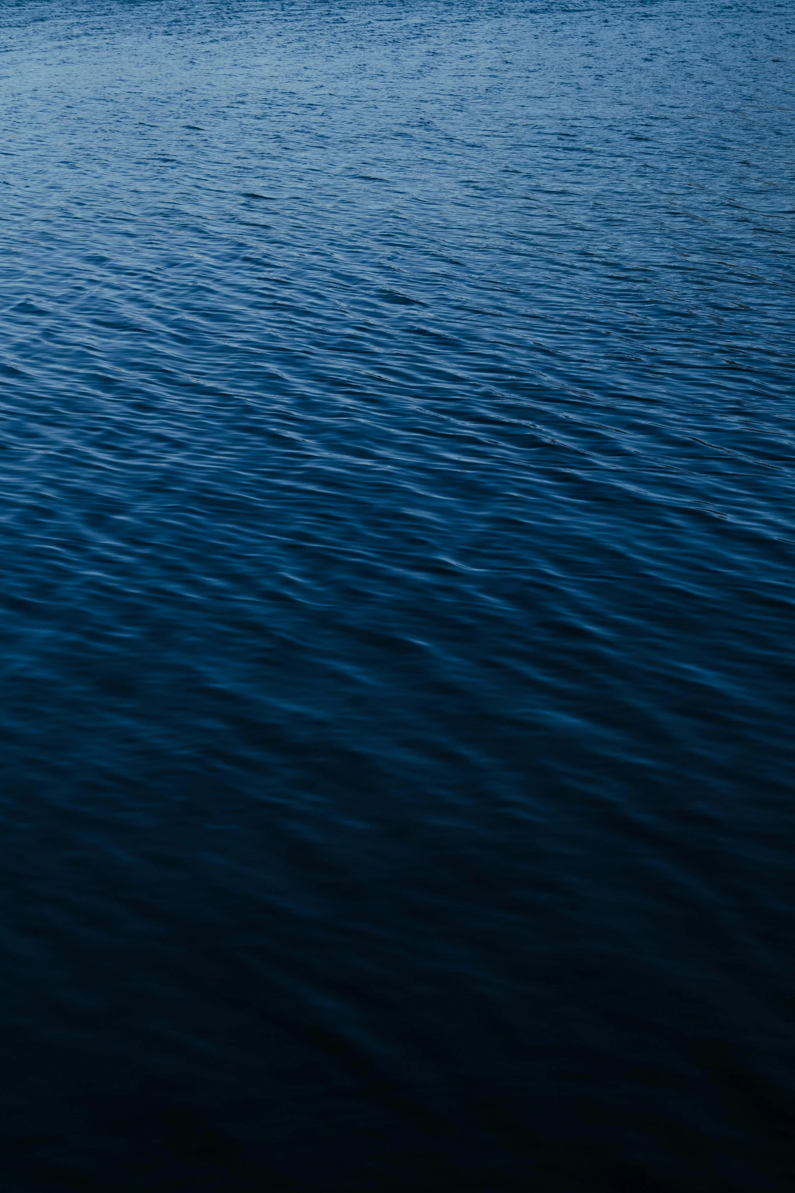 a boat is out on a calm ocean