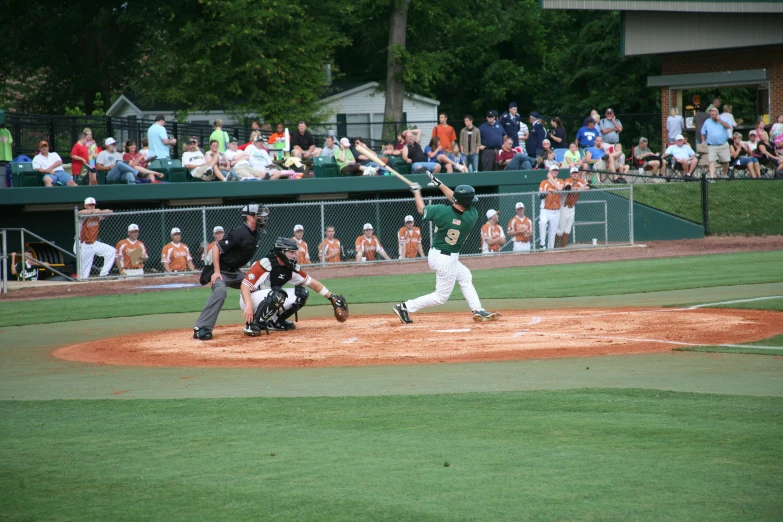 there is a baseball game in progress as the batter prepares to hit