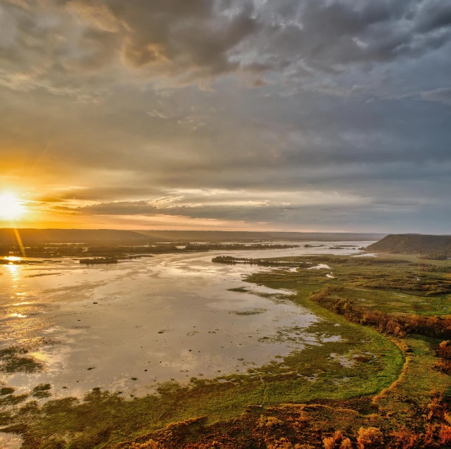 a large body of water next to some land