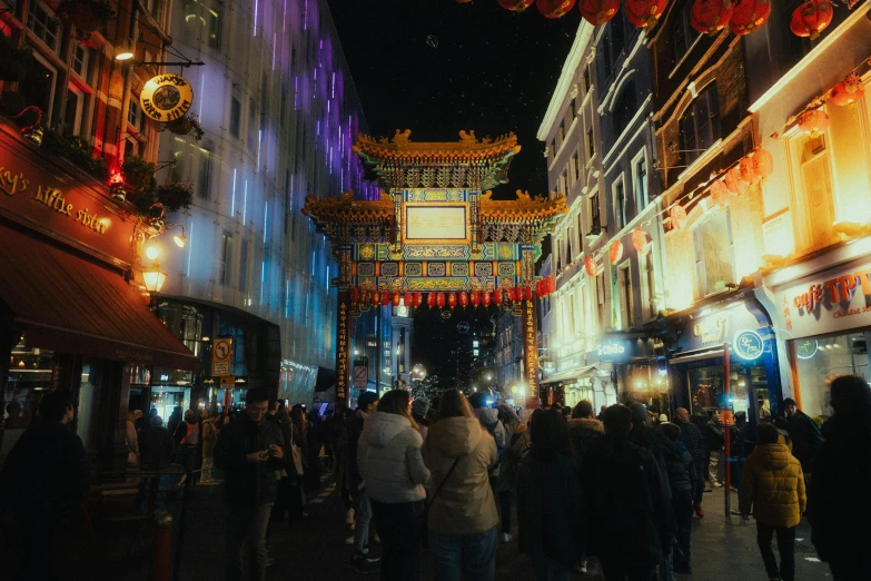 an asian shopping area that is lit up with lights