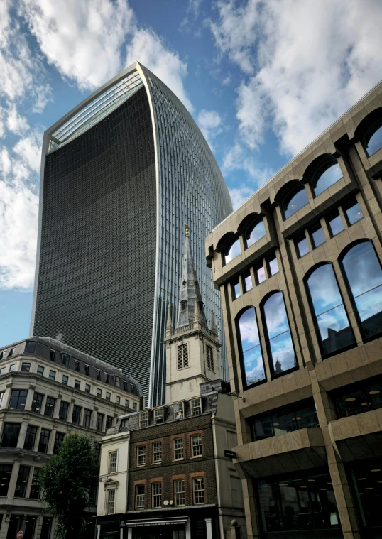 two buildings with windows that have a spire