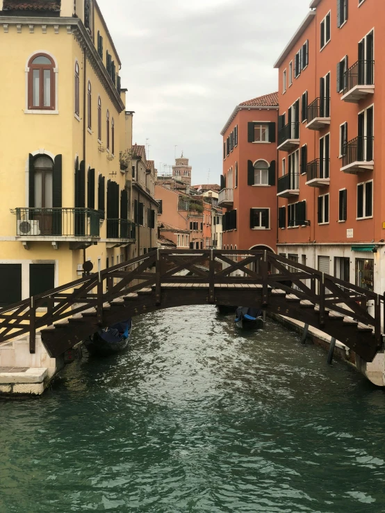 a narrow river running through the center of a city