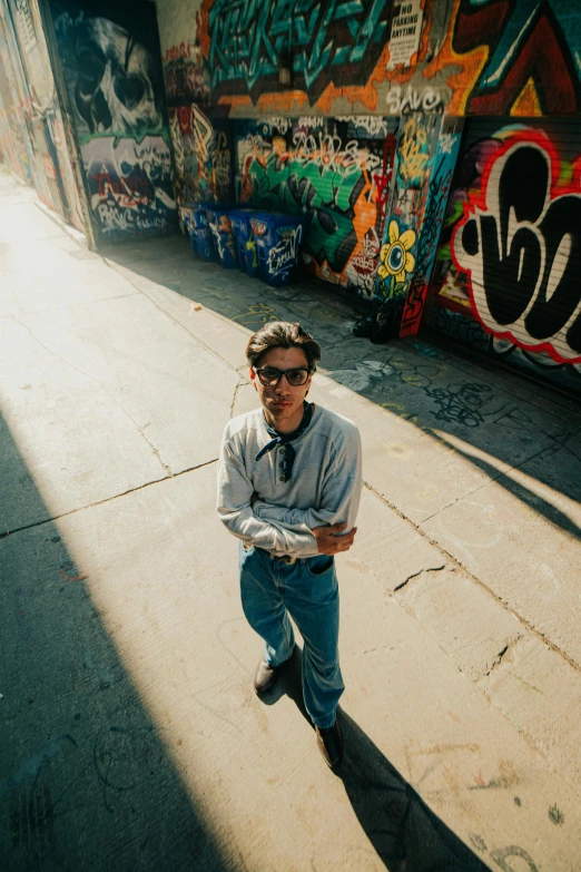 a man standing in the middle of a sidewalk