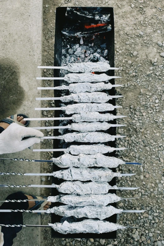 a person is cooking food on a grill