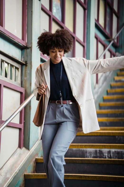 an image of a woman walking up some stairs