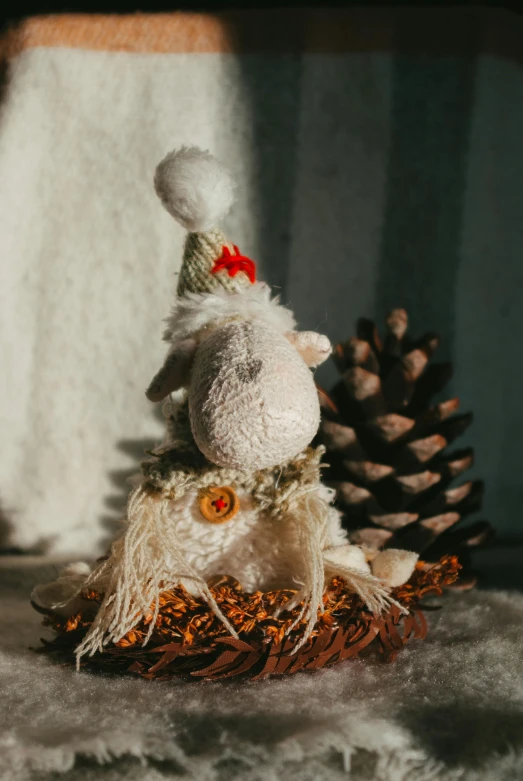 a white teddy bear sitting on a pile of wood