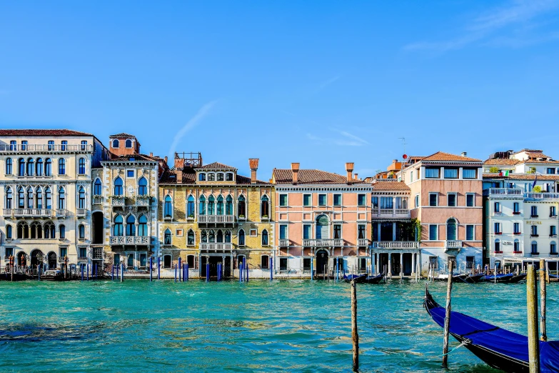 a number of buildings sitting on the water