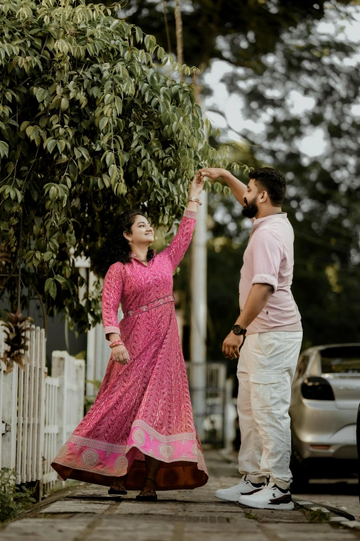 a couple holds their hands in front of the camera