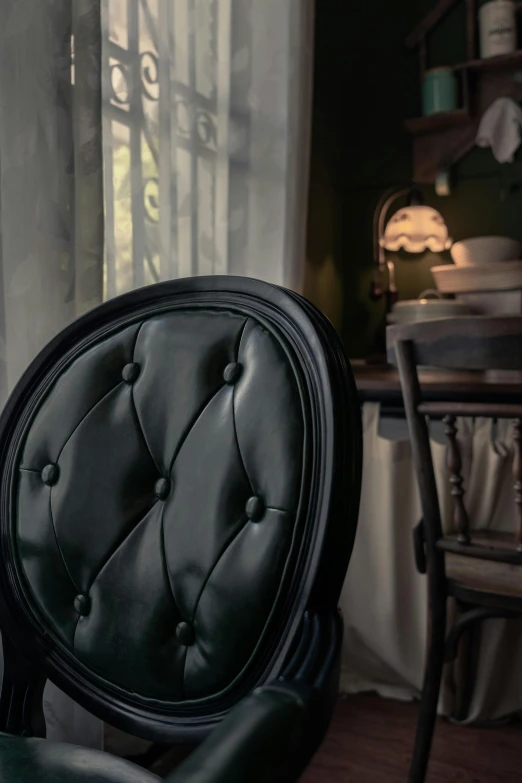 a black chair sitting in front of a window