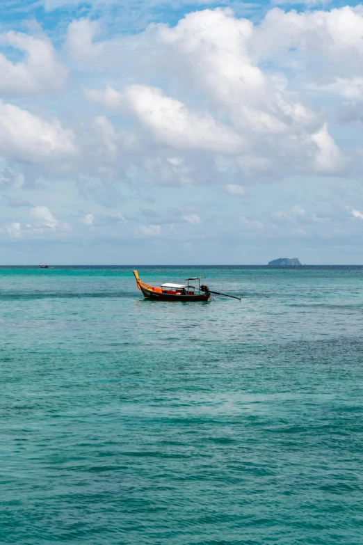 an old boat in the middle of some water