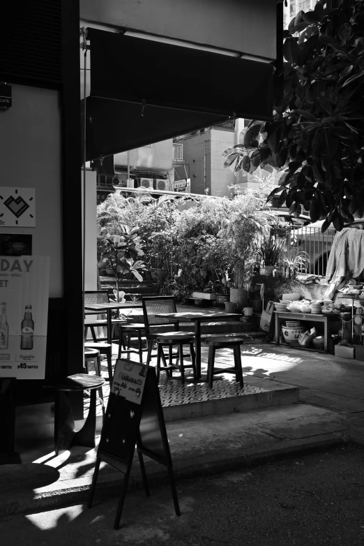 a restaurant patio with benches and tables