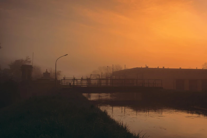 there is a light rail on the bridge in the fog