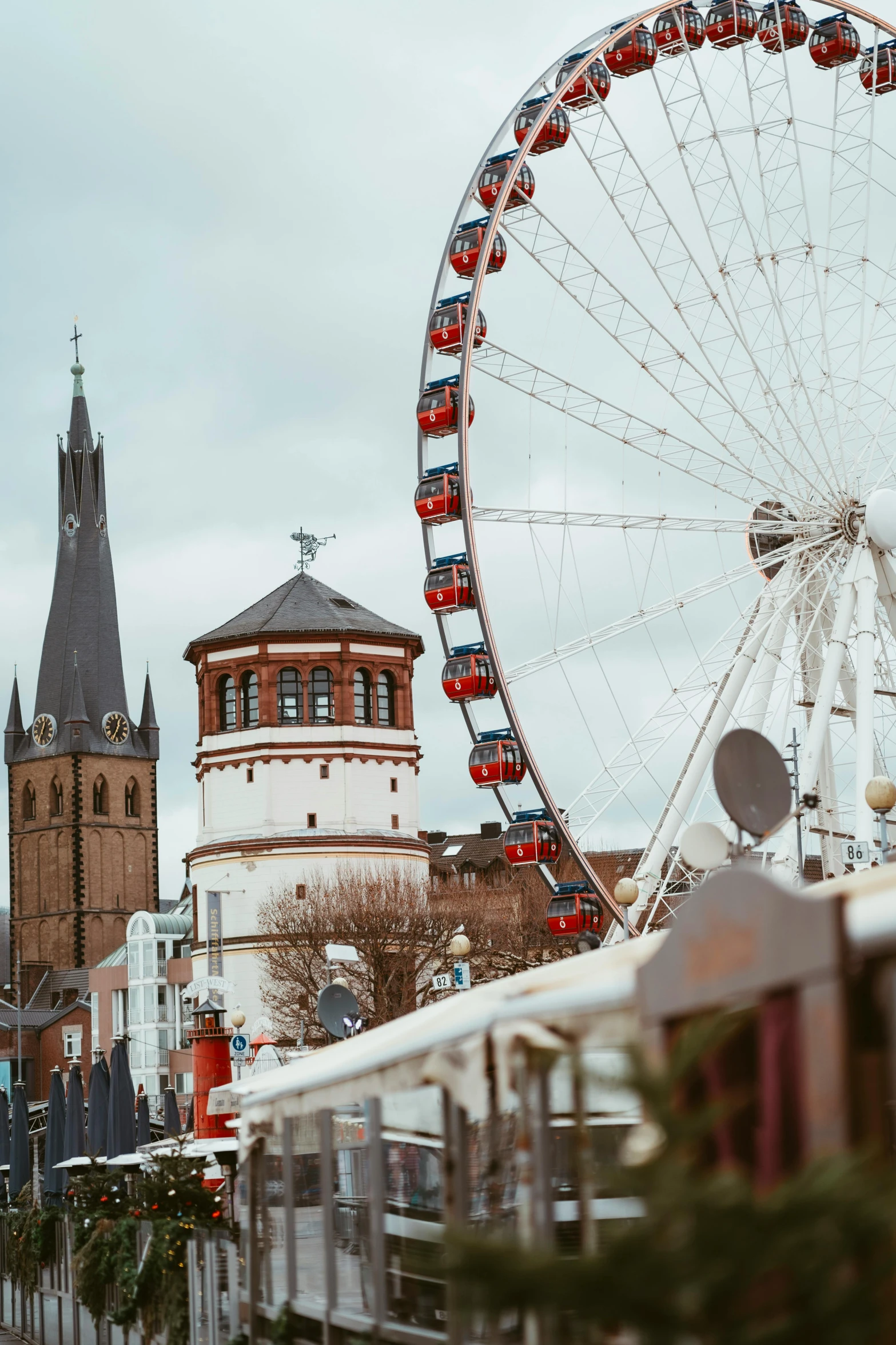 a ferris wheel sits in front of a ferris building