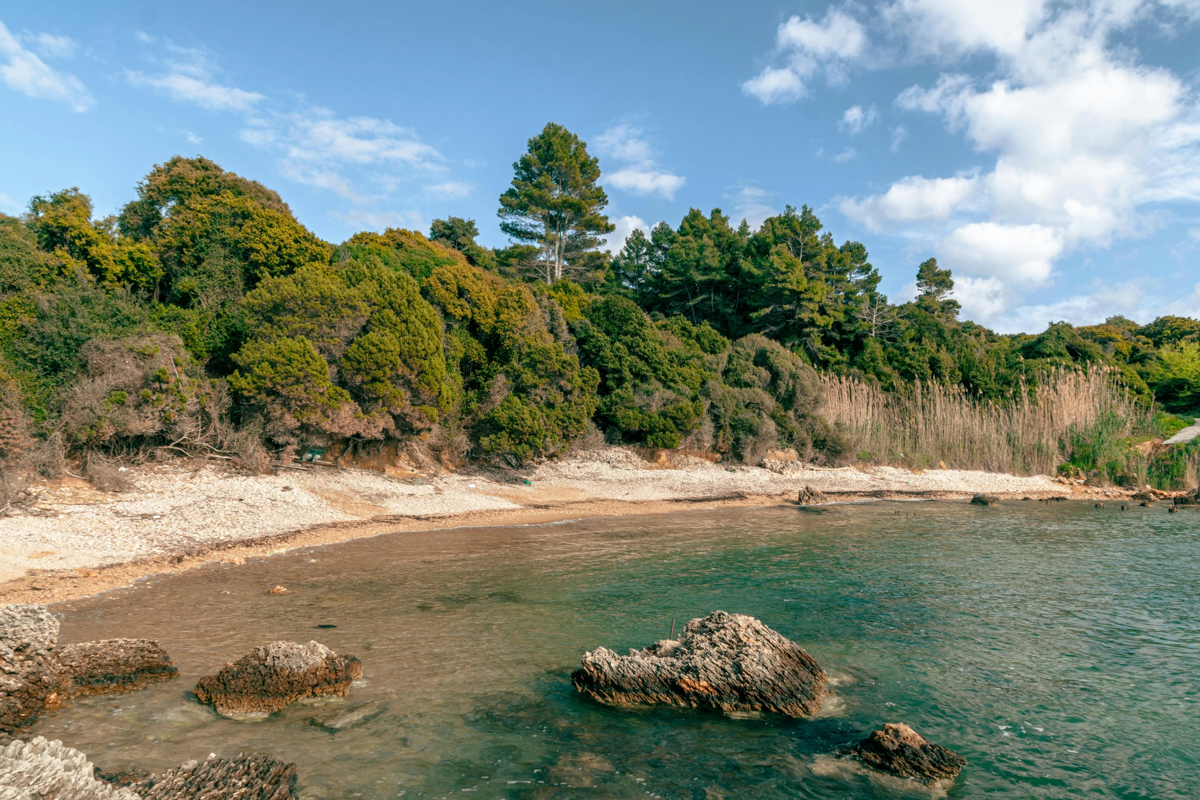 a large body of water with rocks on it