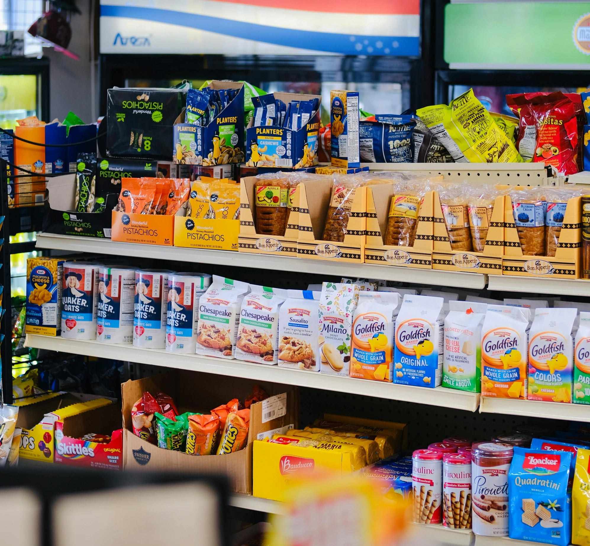 an assortment of food products displayed on shelves