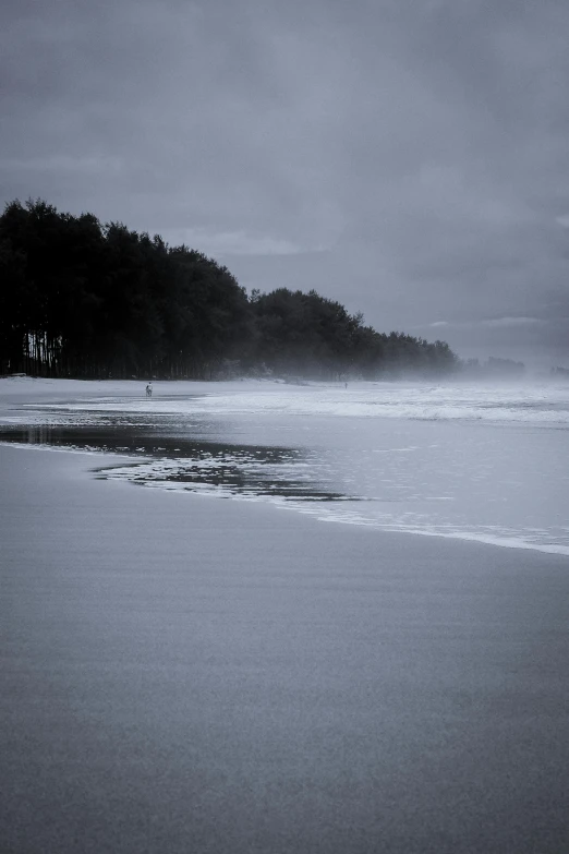 a lone surfer on the ocean waves near the shore