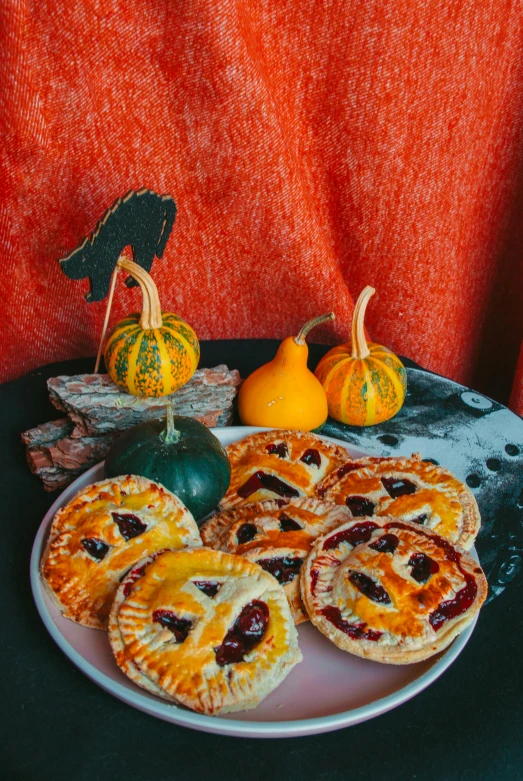 mini pies on a white plate on a table