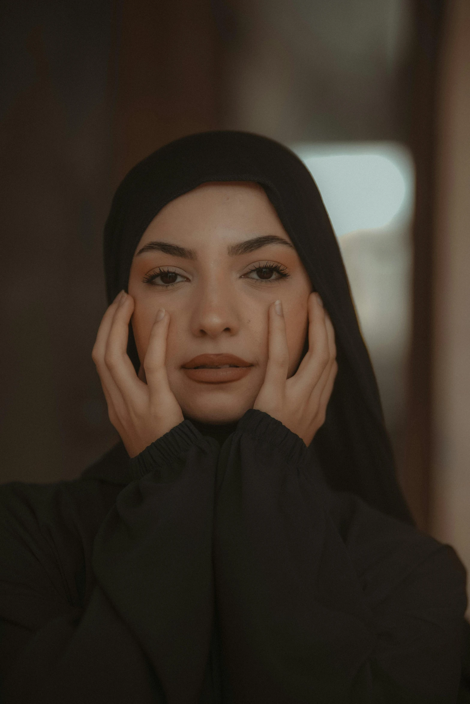 a girl with dark hair and a black veil