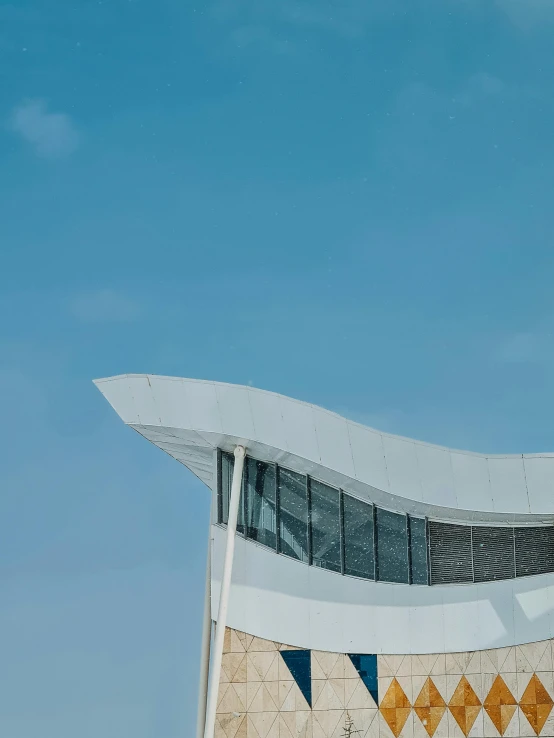 the side of an airplane flying over a building